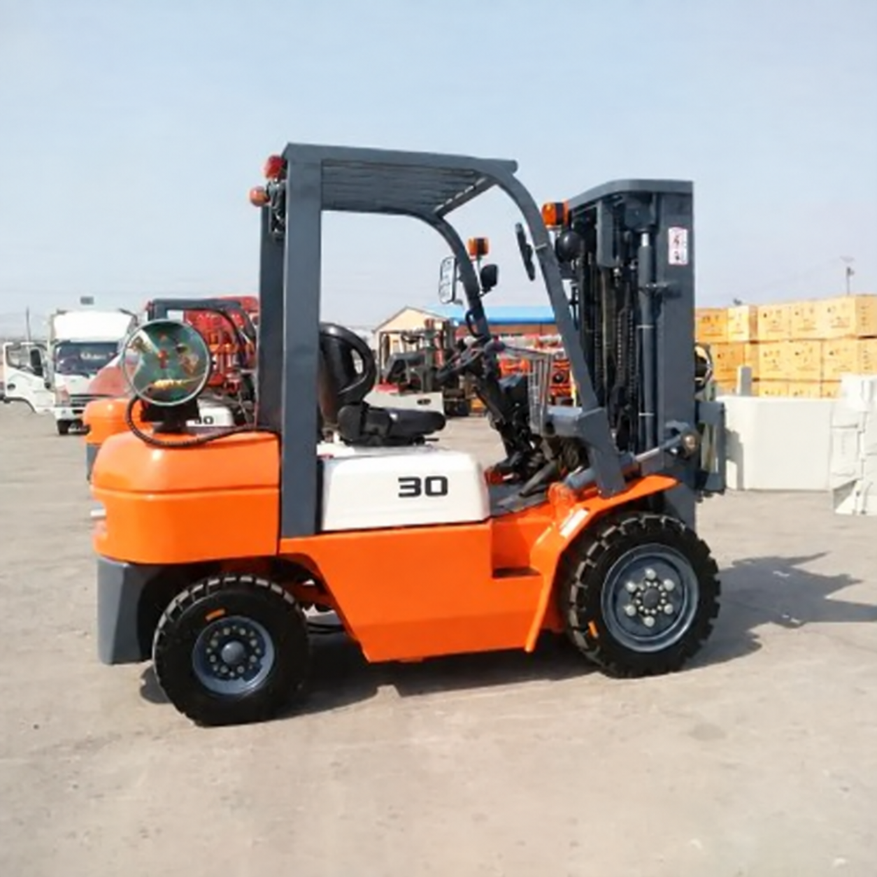 Unbranded orange LPG forklift truck in an industrial yard