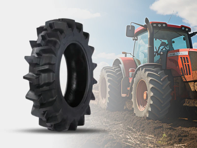 Agricultural tyre with a tractor working in a field