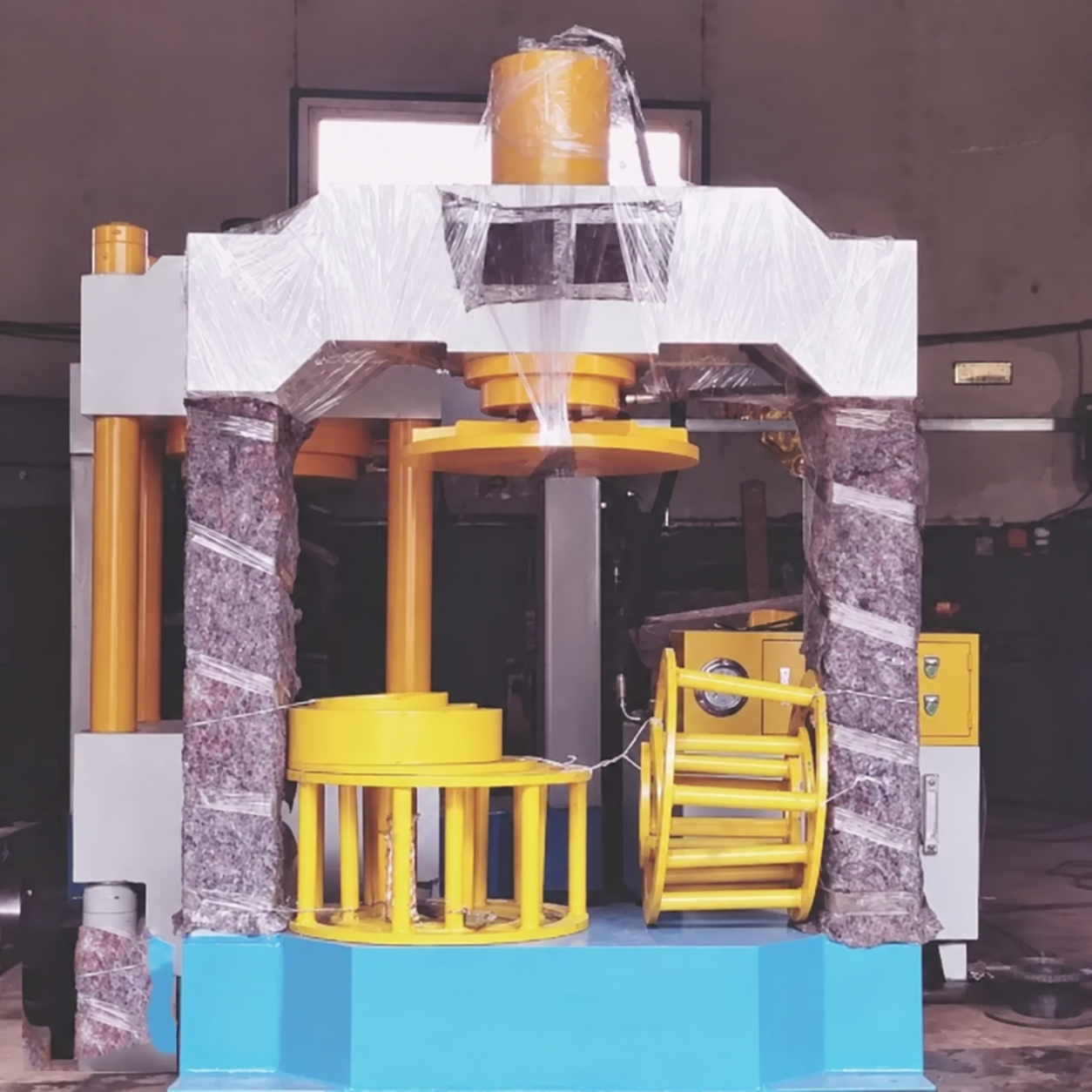 Unbranded hydraulic gantry tire press machine in a factory
